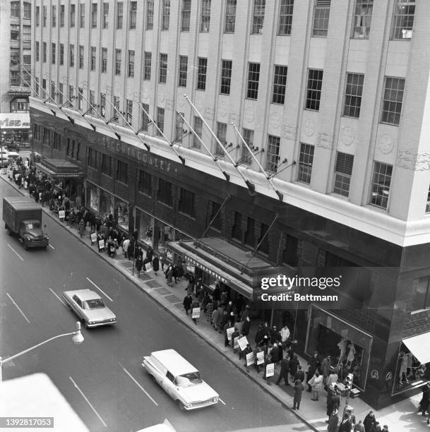 Employees of Bloomingdale's department store form a picket line, which surrounds the store. The clerks rejected the three-year contract which would...