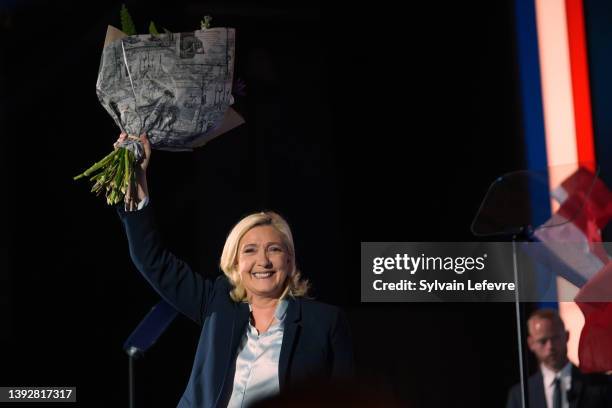 National Rally candidate for upcoming 2nd round of French presidential election, Marine Le Pen waves as she holds her last meeting during the...