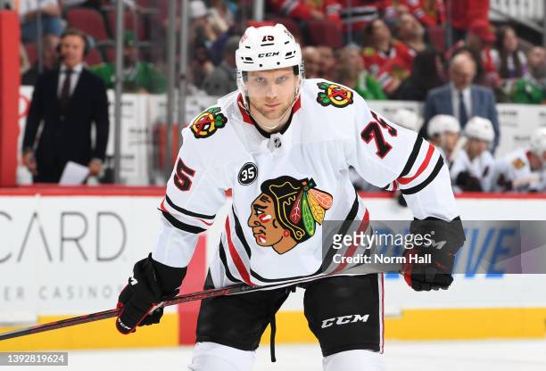 Alec Regula of the Chicago Blackhawks gets ready during a face off against the Arizona Coyotes at Gila River Arena on April 20, 2022 in Glendale,...