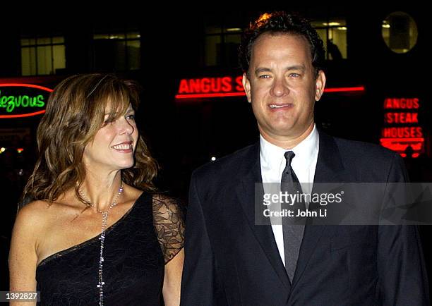 Actor Tom Hanks and his wife Rita Wilson arrive for the British premiere of "The Road To Perdition" September 18 2002 at the Odeon Cinema in...