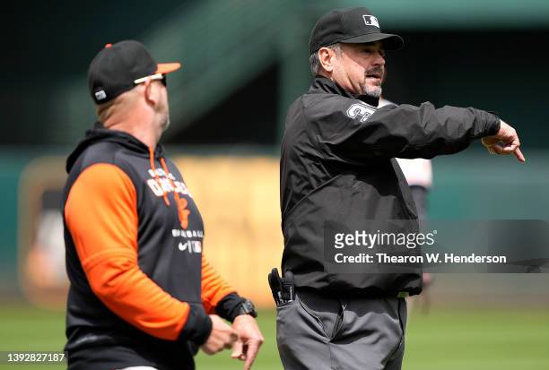 First base umpire Rob Drake throws manager Brandon Hyde of the Baltimore Orioles out of the game against the Oakland Athletics in the fourth inning...
