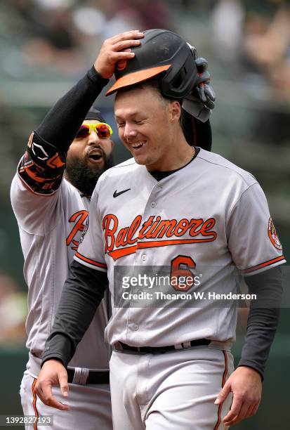 Ryan Mountcastle and Rougned Odor of the Baltimore Orioles celebrates after Mountcastle scored against the Oakland Athletics in the top of the fifth...