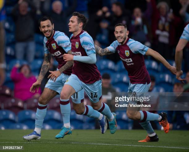Connor Roberts of Burnley celebrates scoring their team's first goal with team mates Dwight McNeil and Josh Brownhill during the Premier League match...