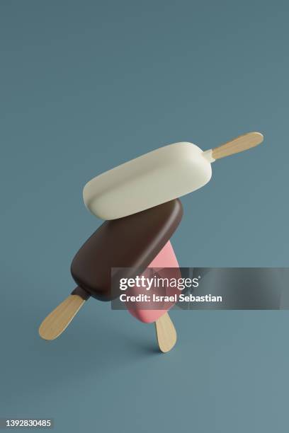 funny digitally generated image of a group of three delicious chocolate ice cream with stick balancing on blue background. - chocolate concept stock pictures, royalty-free photos & images