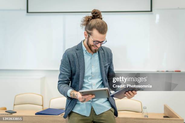 young man in front of whiteboard - teacher in front of whiteboard stock pictures, royalty-free photos & images