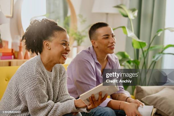 diverse group of friends discussing a book - poetry reading stock pictures, royalty-free photos & images