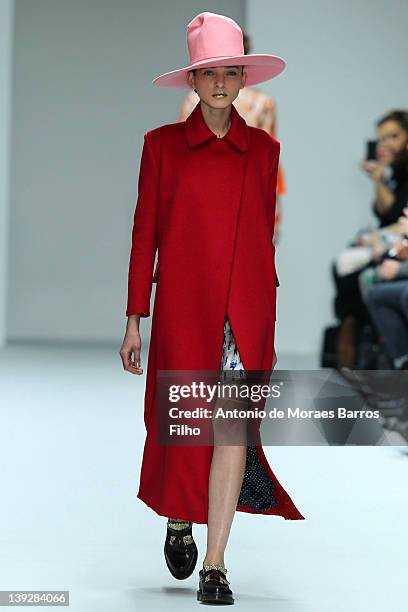 Model walks the runway at the Kinder Aggugini Autumn/Winter 2012 show at London Fashion Week at Embankment Gallery on February 18, 2012 in London,...