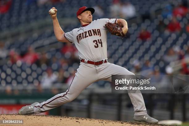 Mark Melancon of the Arizona Diamondbacks pitches in the ninth inning against the Washington Nationals at Nationals Park on April 21, 2022 in...