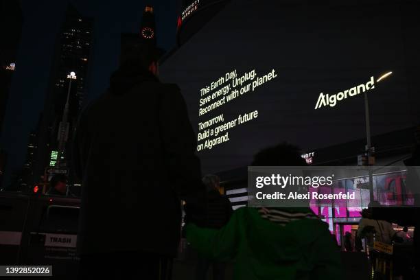 Billboards go dark and display a message in Times Square for Earth Day on April 21, 2022 in New York City. A total of 19 billboards went dark, after...