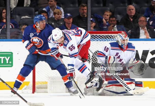 Ryan Lindgren of the New York Rangers defends against Zach Parise of the New York Islanders at the UBS Arena on April 21, 2022 in Elmont, New York....