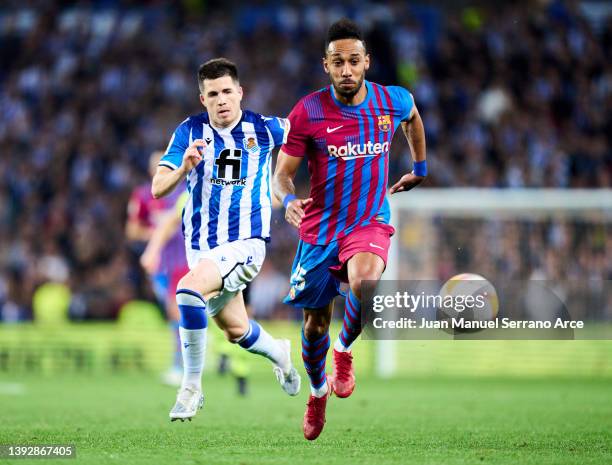 Pierre-Emerick Aubameyang of FC Barcelona duels for the ball with Igor Zubeldia of Real Sociedad during the LaLiga Santander match between Real...