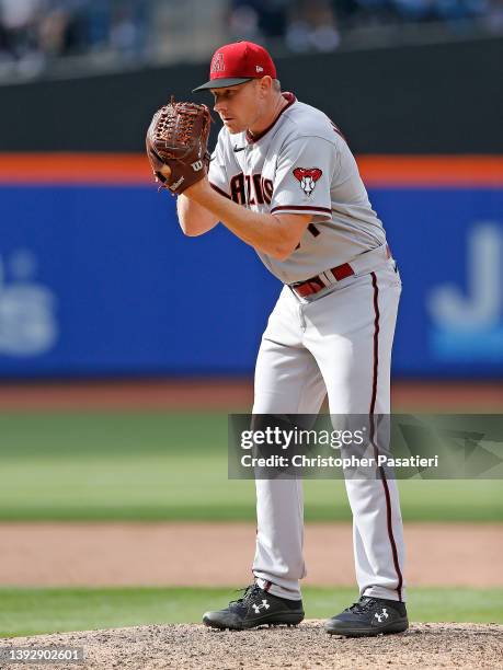 Mark Melancon of the Arizona Diamondbacks looks in for the sign while pitching in relief during the game against the New York Mets at Citi Field on...