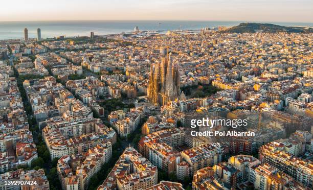 sagrada familia and barcelona skyline at sunrise, aerial view. catalonia, spain - barcelona spanje stockfoto's en -beelden