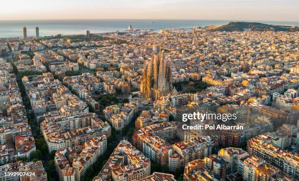 sagrada familia and barcelona skyline at sunrise, aerial view. catalonia, spain - barcelona birds eye view stock pictures, royalty-free photos & images