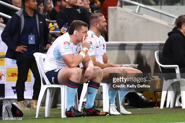Jamie Roberts is seen on the bench after receiving a yellow card with Angus Bell of the Waratahs during the round 10 Super Rugby Pacific match...
