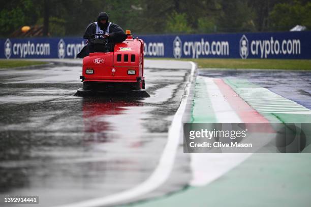 Track marshal clears rain water from the circuit prior to practice ahead of the F1 Grand Prix of Emilia Romagna at Autodromo Enzo e Dino Ferrari on...