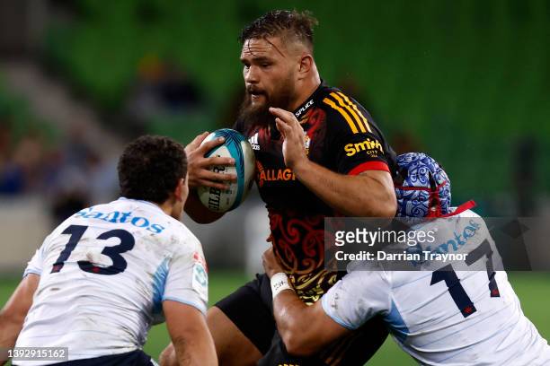 Tetera Faulkner of the Waratahs tackles Angus Ta'avao of the Chiefs during the round 10 Super Rugby Pacific match between the Chiefs and the NSW...