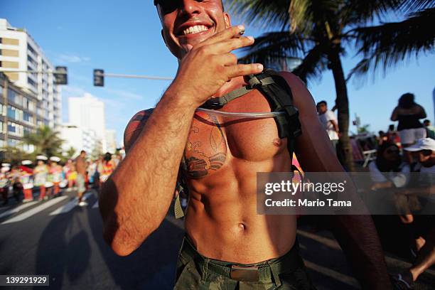 Reveler smiles during Carnival celebrations along Ipanema beach on February 18, 2012 in Rio de Janiero, Brazil. Carnival is the grandest holiday in...