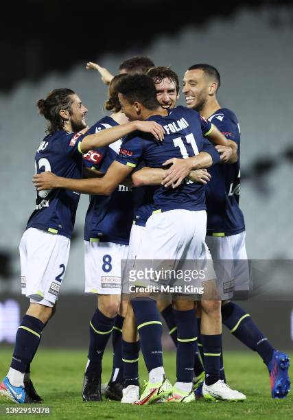 Ben Folami of the Victory celebrates with team mates after scoring a goal during the A-League Mens match between Macarthur FC and Melbourne Victory...