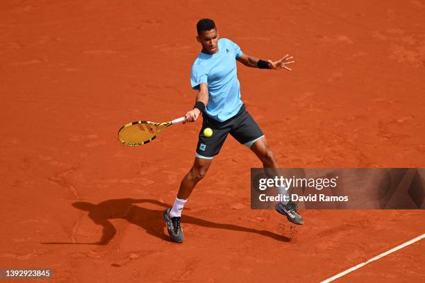 Felix Auger-Aliassime of Canada plays a forehand shot in their third round match against Frances Tiafoe of United States during Day Five of Barcelona...