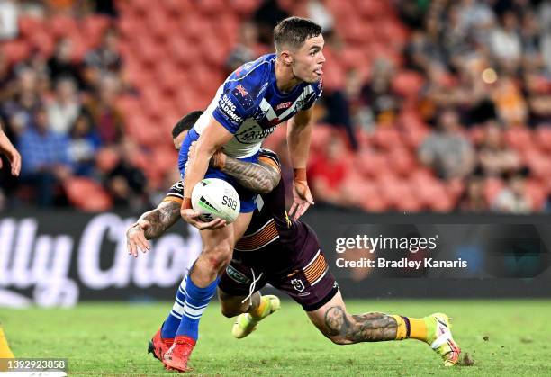 Kyle Flanagan of the Bulldogs looks to offload during the round seven NRL match between the Brisbane Broncos and the Canterbury Bulldogs at Suncorp...