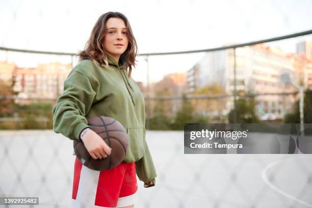 a young woman ready for a streetball match. - streetball stock pictures, royalty-free photos & images