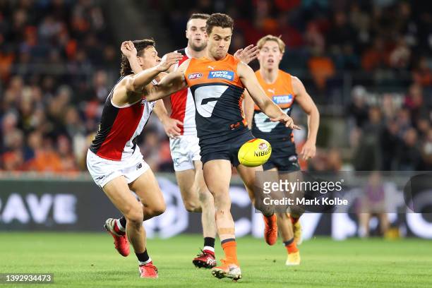 Josh Kelly of the Giants kicks during the round six AFL match between the Greater Western Sydney Giants and the St Kilda Saints at Manuka Oval on...