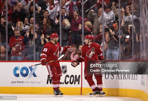 Radim Vrbata of the Phoenix Coyotes celebrates with Adrian Aucoin after Vrbata scored the game winning goal against the Dallas Stars in overtime of...