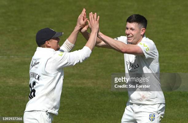 Durham bowler Matthew Potts celebrates with captain Scott Borthwick after taking the wicket of Joe Clarke during day two of the LV= Insurance County...