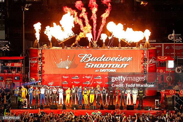 The drivers take the stage during driver introductions prior to the start of the NASCAR Budweiser Shootout at Daytona International Speedway on...