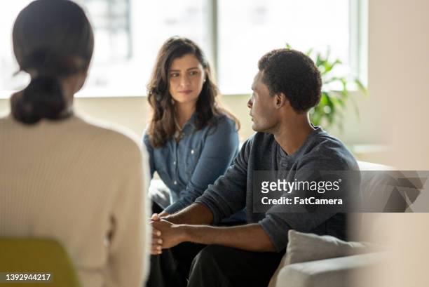 man sharing during couples counseling - group therapy stock pictures, royalty-free photos & images