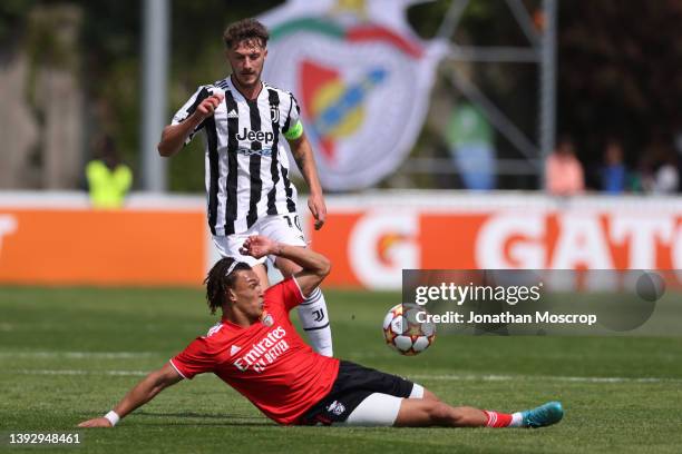 Diego Moreira of SL Benfica challenges Andrea Bonetti of Juventus during the UEFA Youth League 2021/22 Semi-final between Juventus and SL Benfica at...