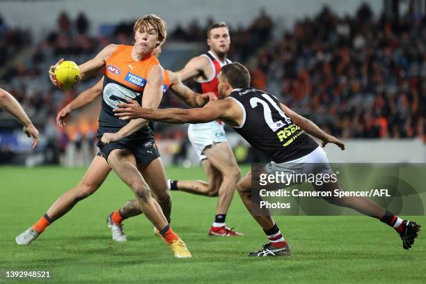 Tanner Bruhn of the Giants is tackled during the round six AFL match between the Greater Western Sydney Giants and the St Kilda Saints at Manuka Oval...