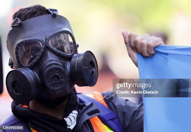 An environmental activist with the group Extinction Rebellion DC participate in an Earth Day rally against fossil fuels on April 22, 2022 in...