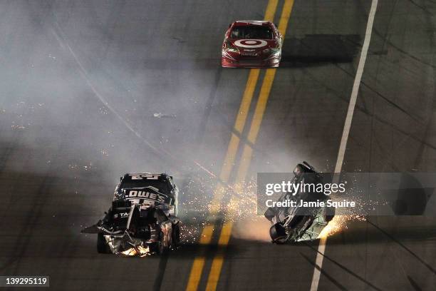 Jeff Gordon, driver of the Drive to End Hunger Chevrolet, flips after an on track incident with Kurt Busch, driver of the Tag Heuer Avant-Garde...