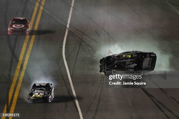 Jeff Gordon, driver of the Drive to End Hunger Chevrolet, flips after an on track incident with the Jimmie Johnson, driver of the Lowe's Chevrolet,...