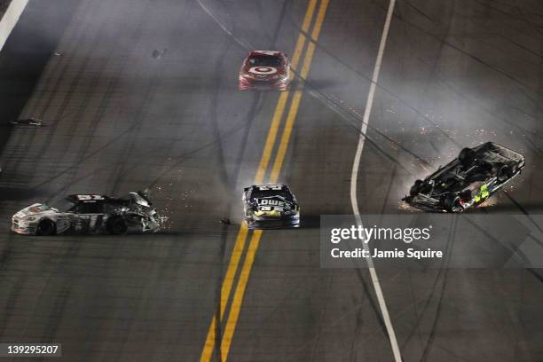 Jeff Gordon, driver of the Drive to End Hunger Chevrolet, flips after an on track incident with the Jimmie Johnson, driver of the Lowe's Chevrolet,...