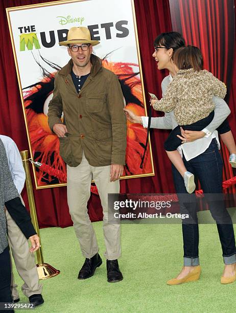 Actor Jason Lee and actress Ceren Alkac with daughter arrive for "The Muppets" Los Angeles Premiere held at the El Capitan Theatre on November 12,...