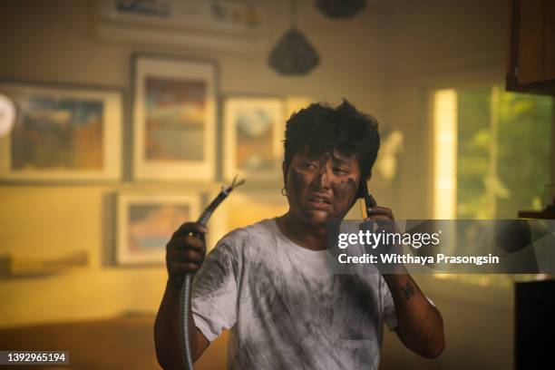 electrocuted man calling for help in dirty burnt funny face - one mistake stock pictures, royalty-free photos & images