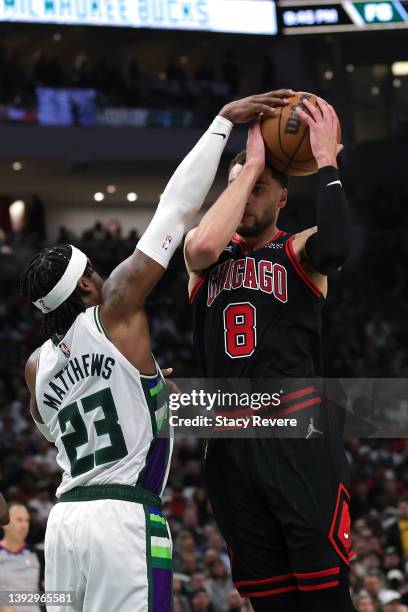 Zach LaVine of the Chicago Bulls is defended by Wesley Matthews of the Milwaukee Bucks during Game Two of the Eastern Conference First Round Playoffs...