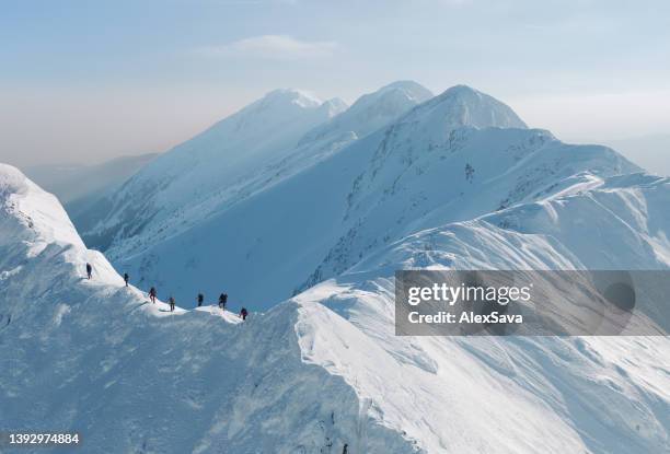 team of mountain climbers - mountain ridge stock pictures, royalty-free photos & images