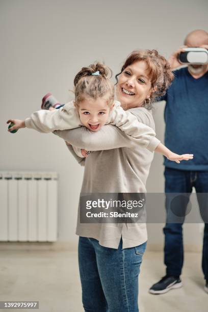 shot of an adorable little girl having fun with her grandmother at home - grandparents raising grandchildren stock pictures, royalty-free photos & images