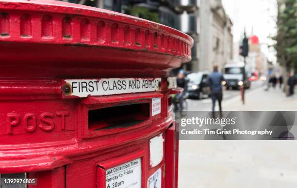 red post in a city business district - postkontor bildbanksfoton och bilder