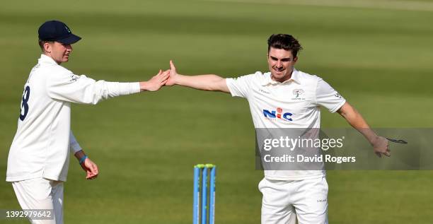 Jordan Thompson of Yorkshire celebrates with team mate George Hill after taking the wicket of Ben Sanderson during the LV= Insurance County...