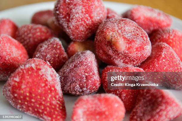 frozen strawberries - frozen fruit stock pictures, royalty-free photos & images