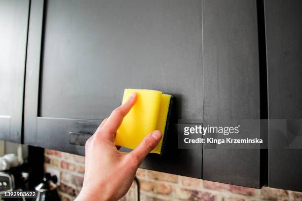 cleaning kitchen cabinets - cabinet door stock pictures, royalty-free photos & images