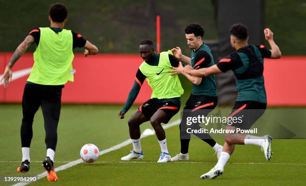 Naby Keita and Curtis Jones of Liverpool during a training session at AXA Training Centre on April 22, 2022 in Kirkby, England.