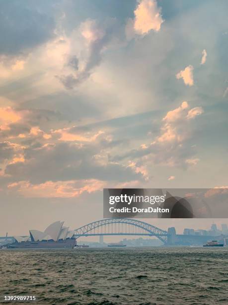 east circular quay, harbor bridge view at dusk in sydney, australia - restaurant sydney outside stock pictures, royalty-free photos & images
