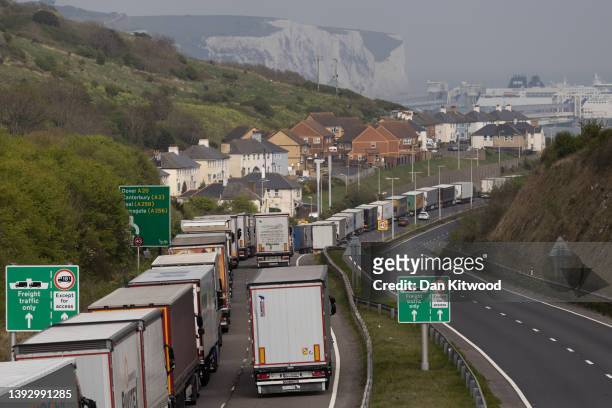 Lorries queue to enter the port of Dover on April 22, 2022 in Dover, England. Operation Brock, a system in which lorries heading to Dover must queue...