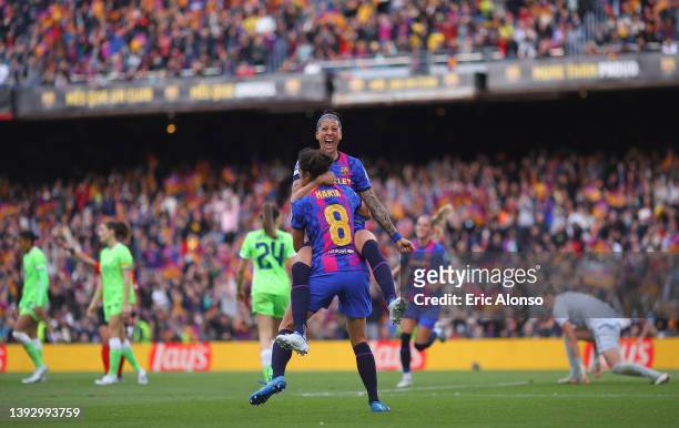 Jennifer Hermoso of FC Barcelona celebrates with teammate Marta Torrejon after scoring their team's third goal during the UEFA Women's Champions...
